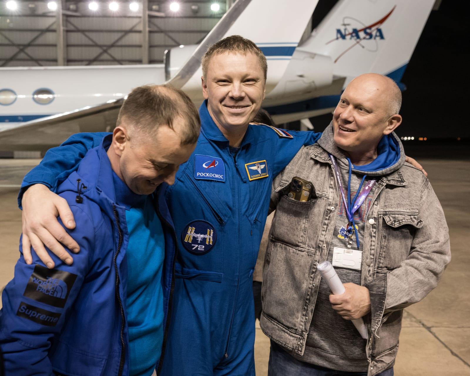Roscosmos cosmonaut Aleksandr Gorbunov smiles as he returns to Johnson Space Center