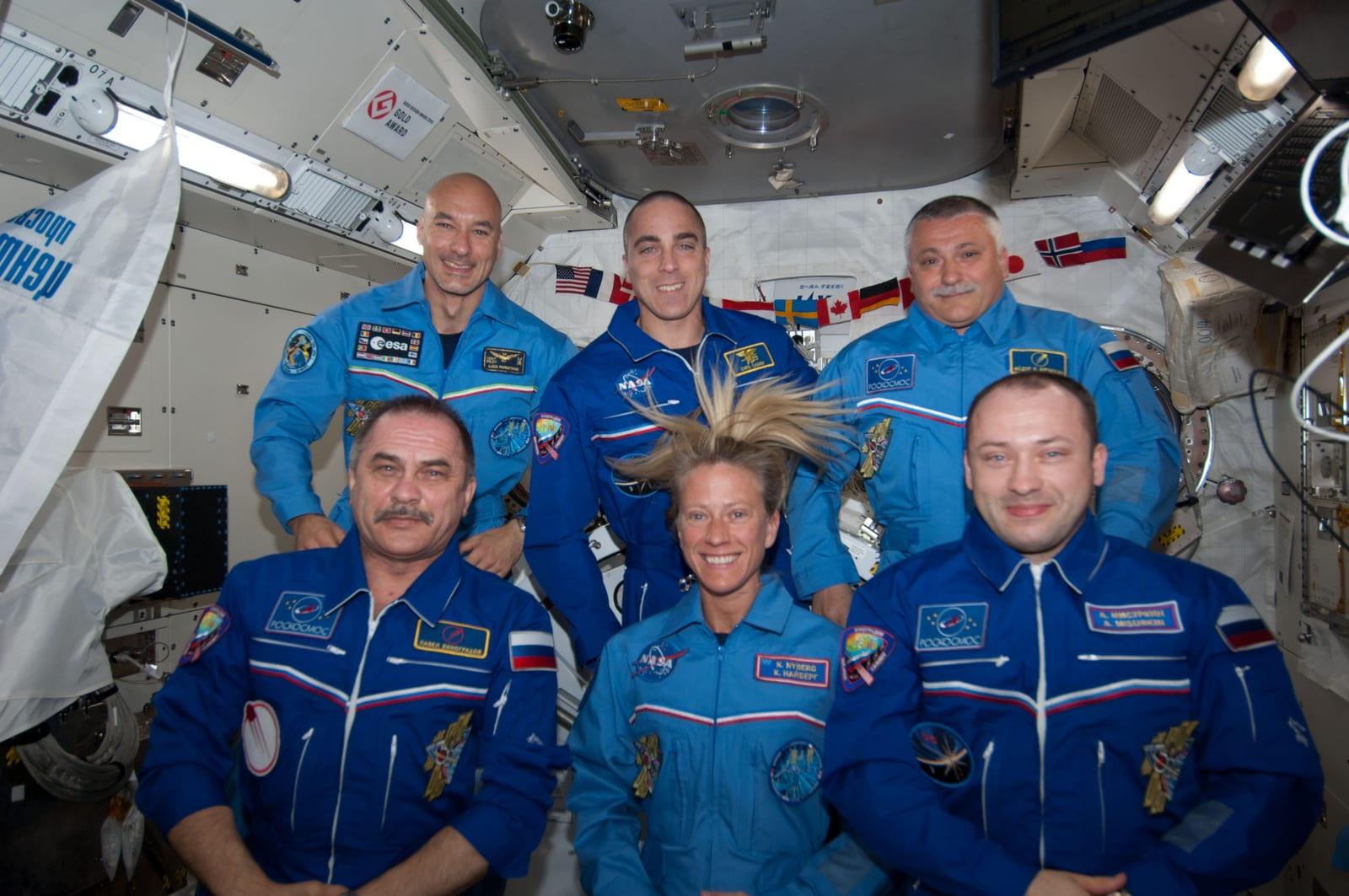 Crew photo during set-up for a videotape tribute to the 50th anniversary of the 1963 launch of Vostok-6.