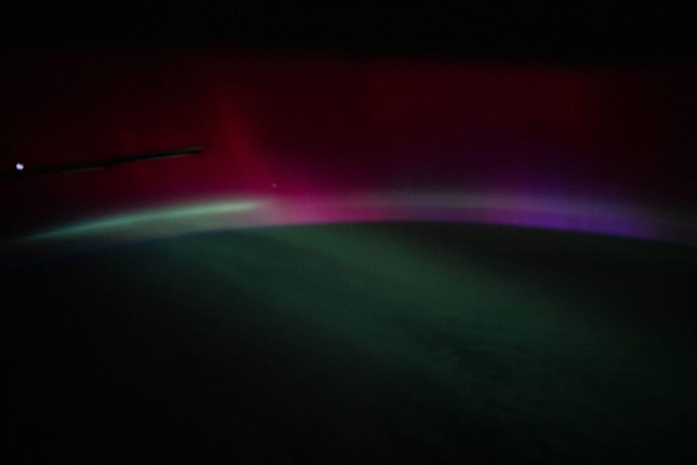 A wispy, multi-colored aurora created by a geomagnetic storm